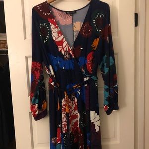Flowing floral maxi dress with tie waist belt.